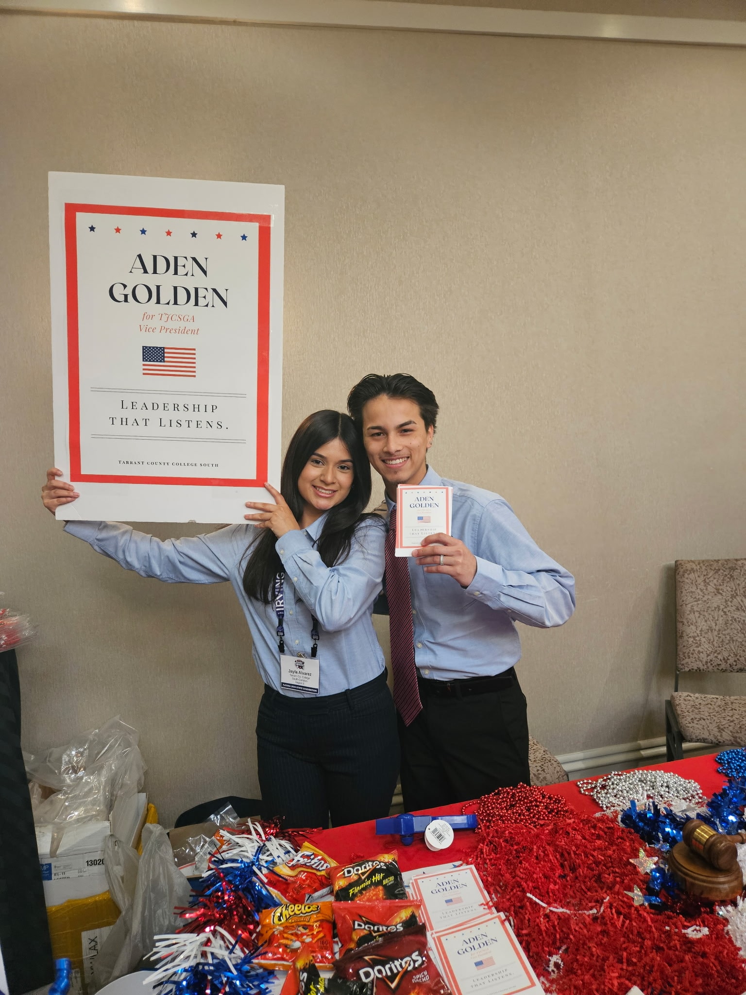 Supporters of Aden Golden holding campaign signs and flyers while Aden campaigns for Texas Junior College Student Government Association Vice President